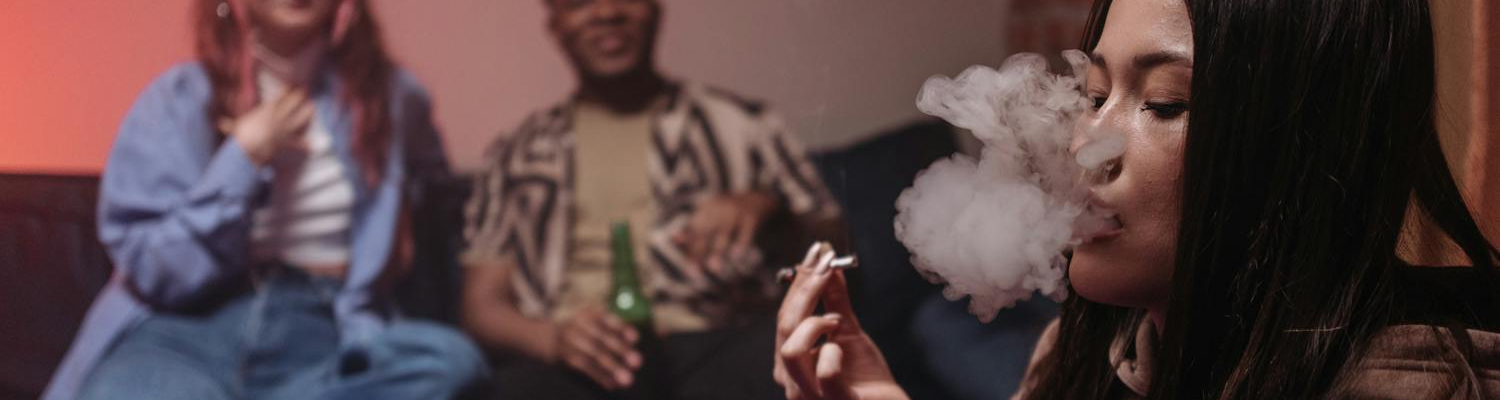A group of young people smoking marijuana as permited by California sober lifestyle. 