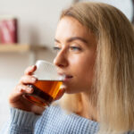a woman drinking juice