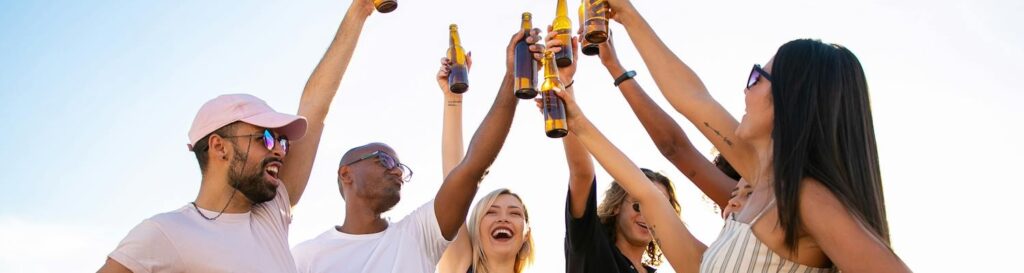 A group of people drinking together, which leads to alcohol use disorder and makes the issue of substance abuse in the LGBTQ+ community in California worse