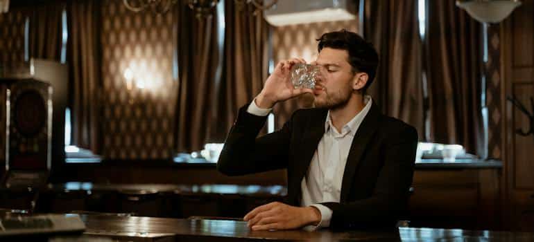 A person drinking alcohol